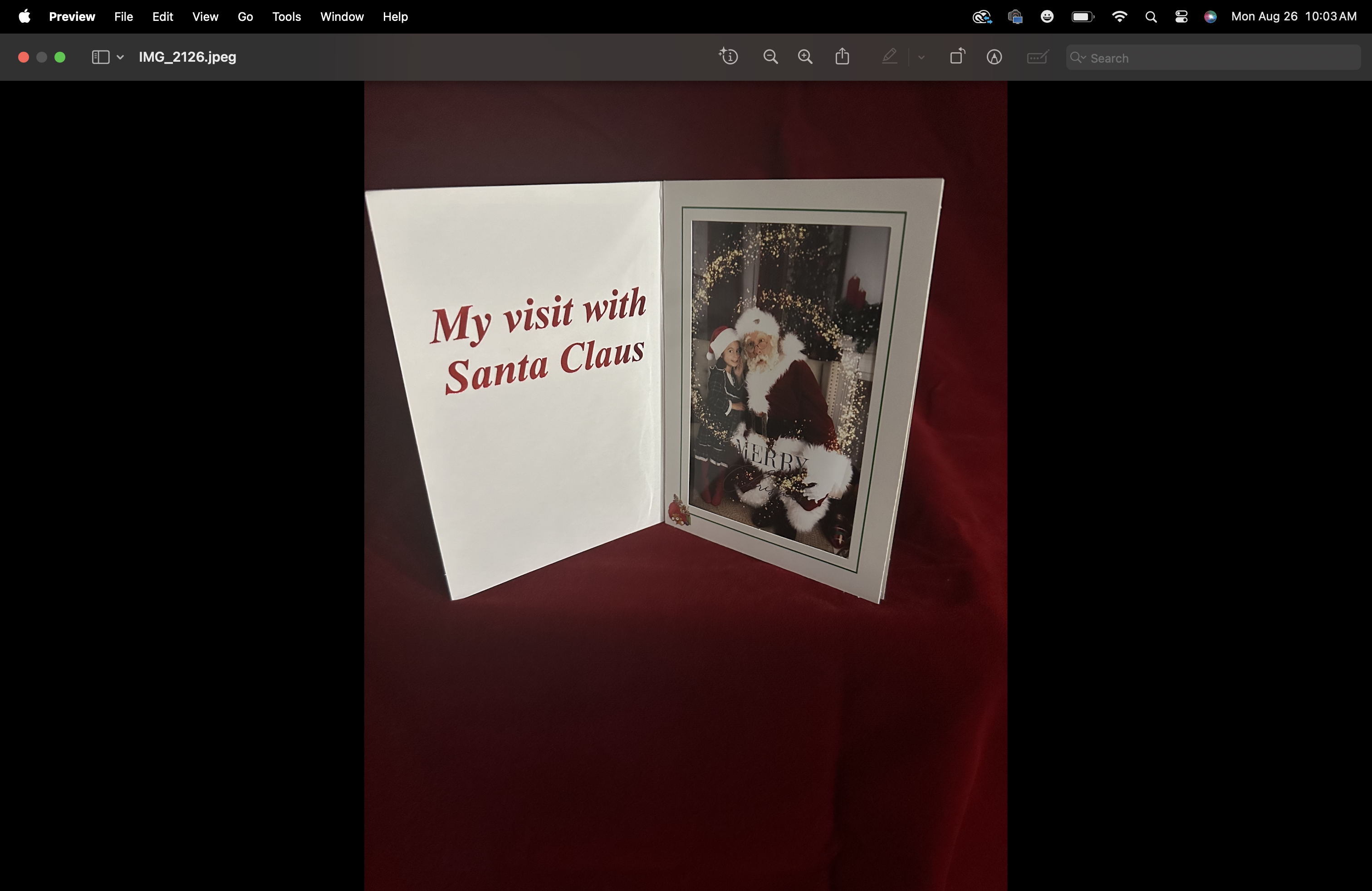 White Santa photo keepsake folder with red foil lettering and a 4x6 portrait