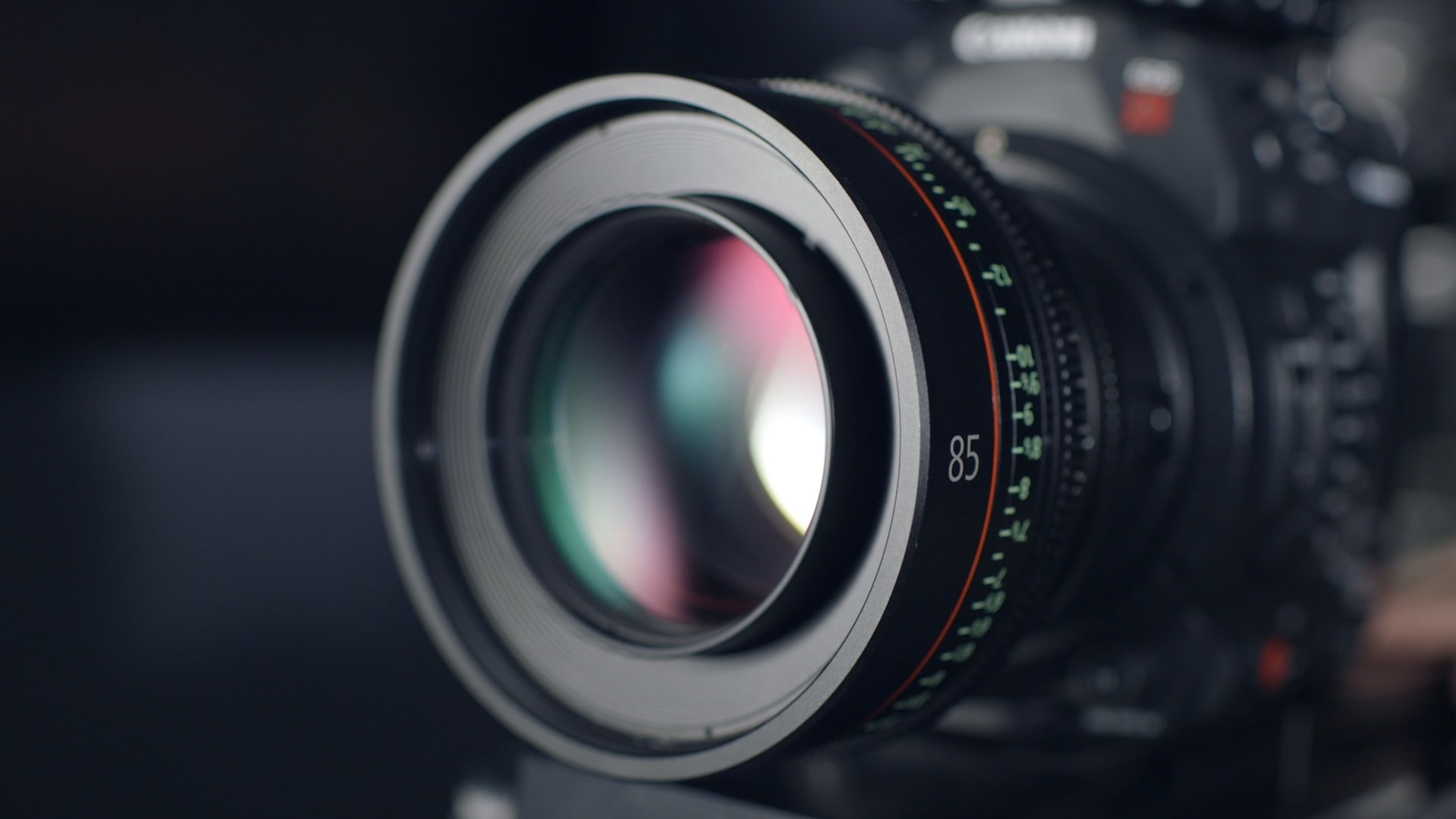Close-up of a professional camera lens used for event photography